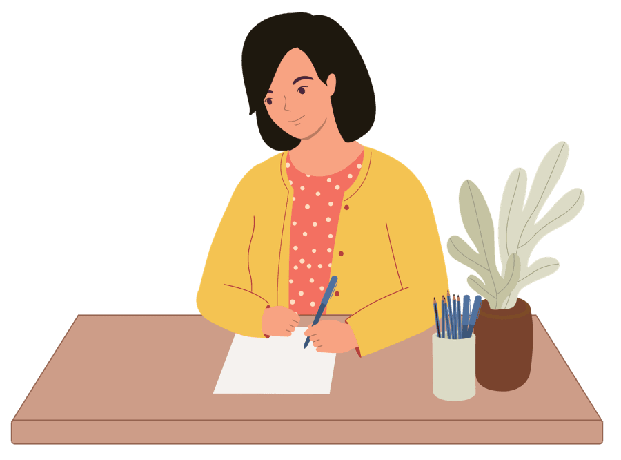 woman sitting at desk writing